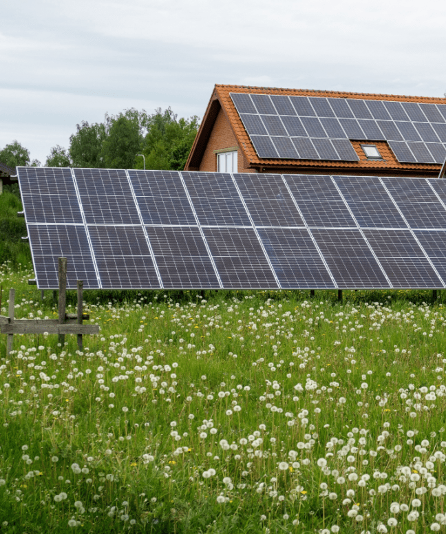 residential property with rooftop and ground solar panels