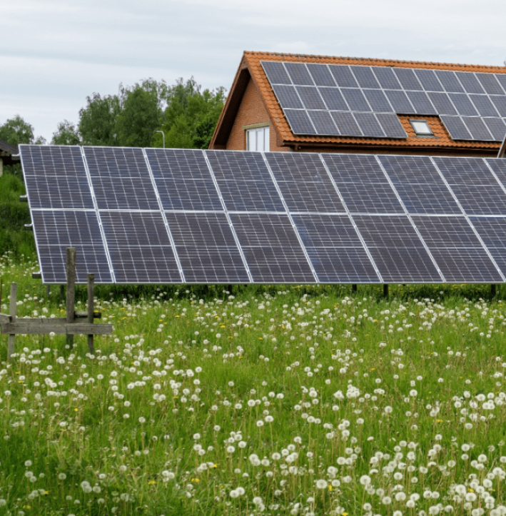 residential property with rooftop and ground solar panels